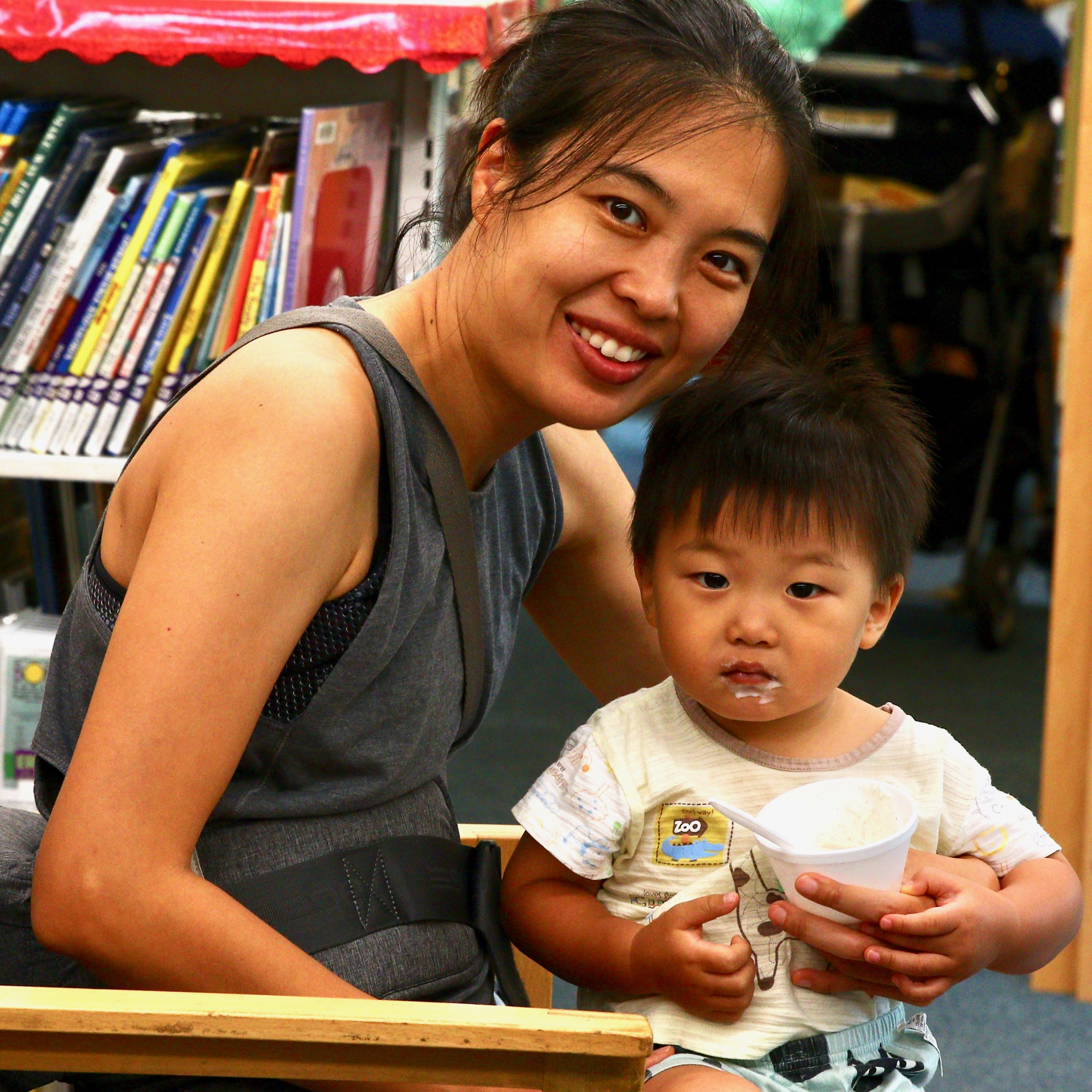 Mother and Child enjoy ice cream in the library